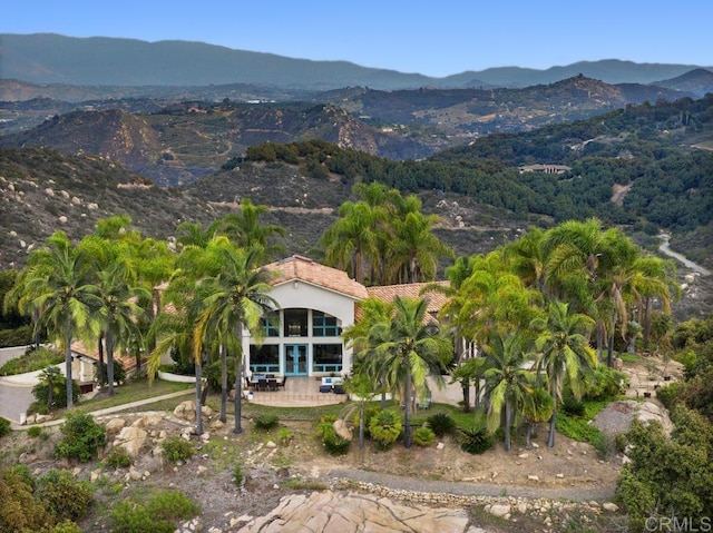 drone / aerial view featuring a mountain view