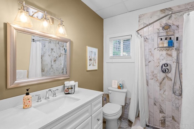 bathroom with walk in shower, vanity, and toilet