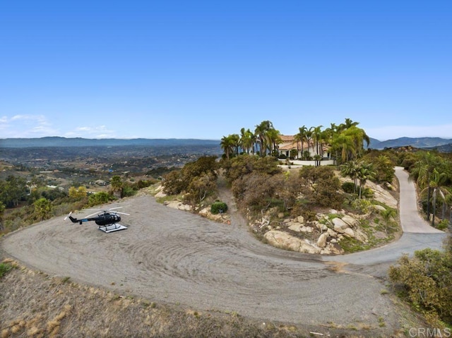 drone / aerial view featuring a mountain view