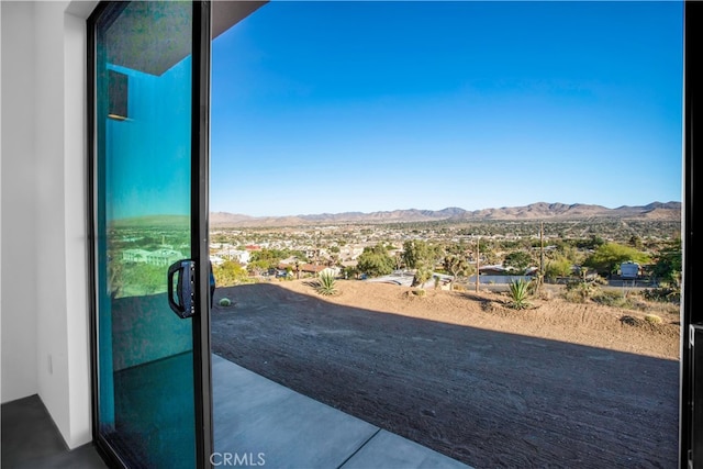 exterior space with concrete floors and a mountain view