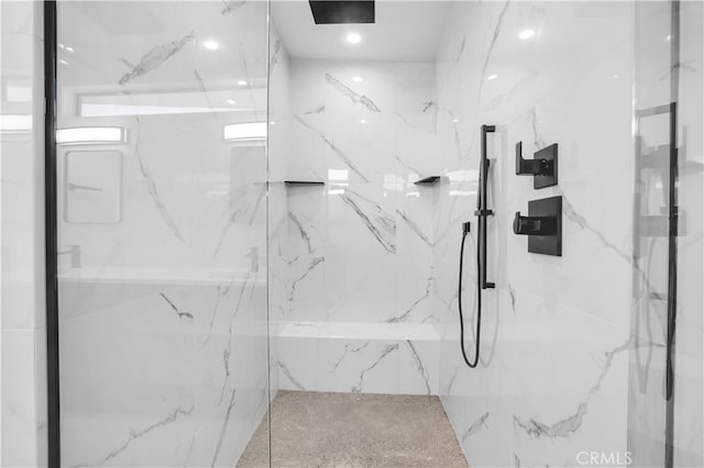 bathroom with a shower with shower door