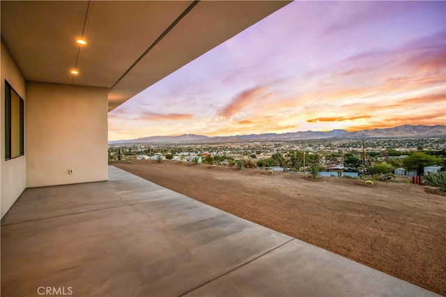 patio terrace at dusk with a mountain view