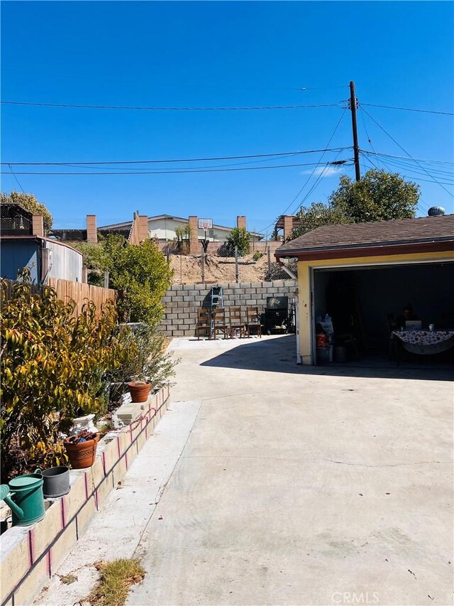 exterior space featuring a garage and an outdoor structure