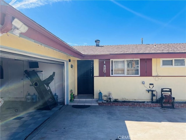 entrance to property featuring a garage