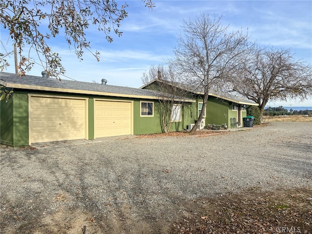 view of side of home with a garage