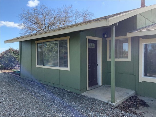 doorway to property featuring a patio area