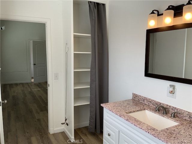 bathroom featuring vanity and hardwood / wood-style flooring