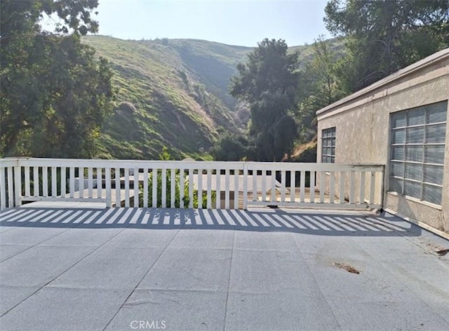view of patio / terrace featuring a mountain view