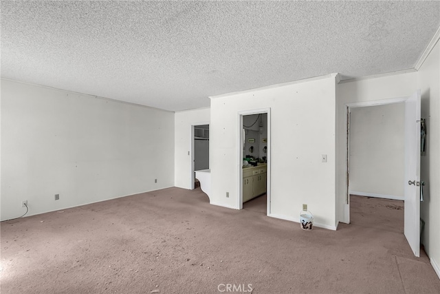 unfurnished bedroom featuring a textured ceiling and carpet floors