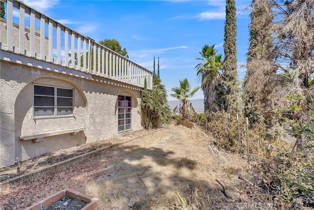view of yard featuring a wooden deck