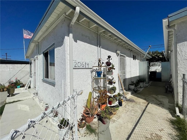 view of side of property with a patio area