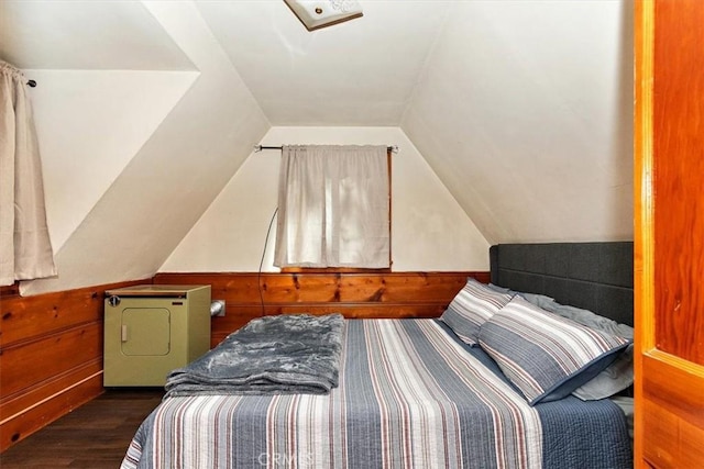 bedroom with lofted ceiling and dark wood-type flooring