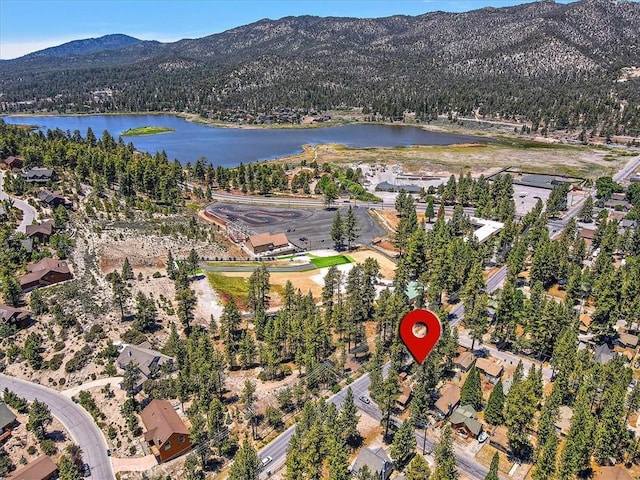 bird's eye view with a water and mountain view