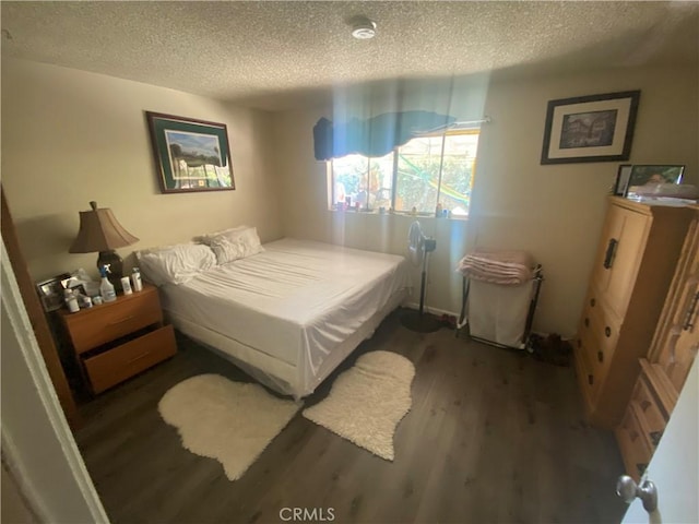 2171 Pomona Ave, Costa Mesa, CA 92627 - bedroom featuring dark hardwood / wood-style flooring and a textured ceiling