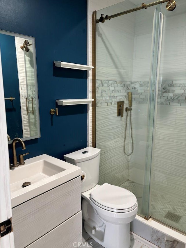 full bath with toilet, a shower stall, and vanity