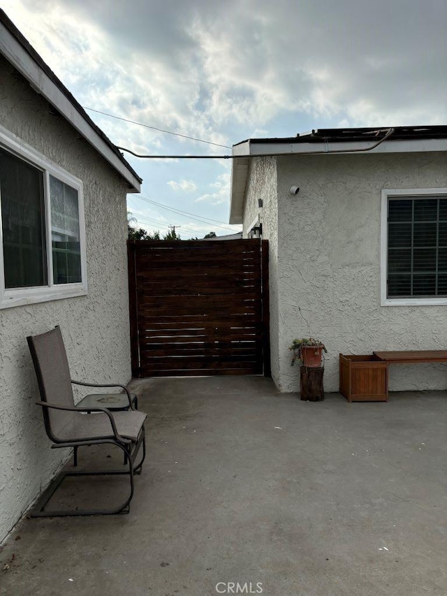 view of patio / terrace with a gate