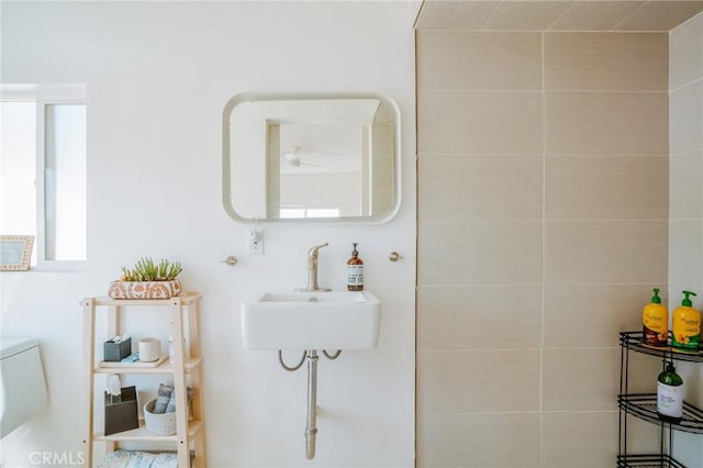 bathroom featuring toilet and sink