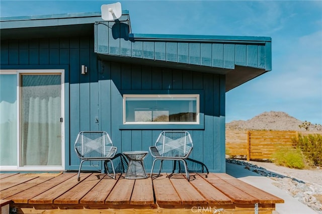 exterior space featuring a deck with mountain view