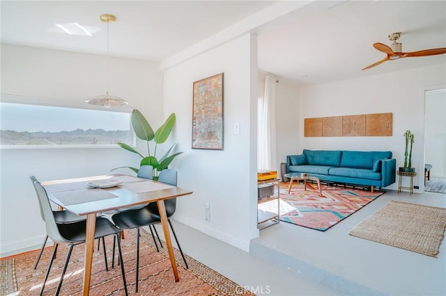 dining space featuring ceiling fan