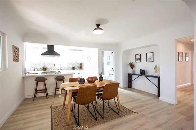 dining space featuring light wood-type flooring