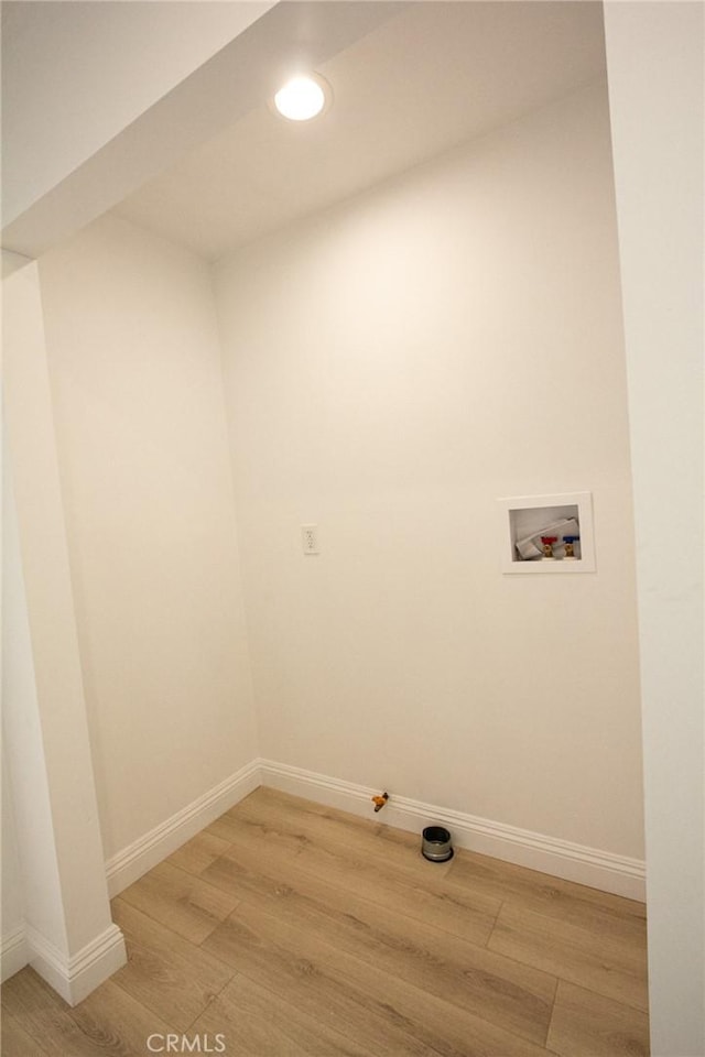 laundry area featuring hookup for a washing machine and light hardwood / wood-style floors