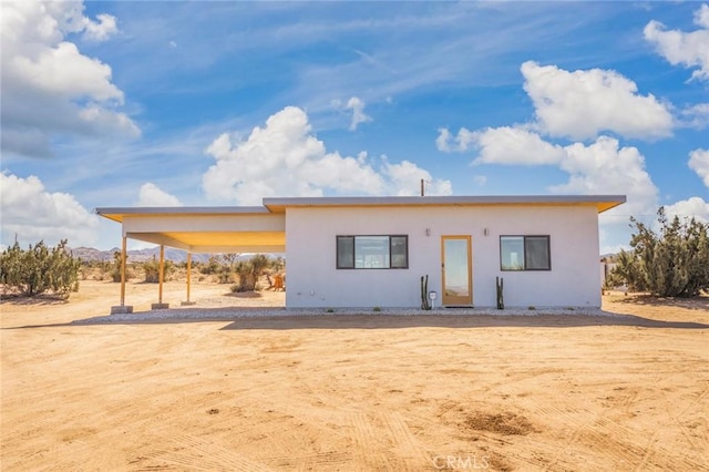 view of front of house with a carport