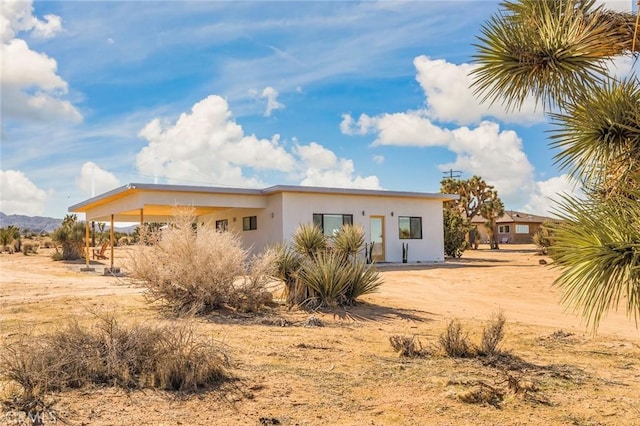 59149 Desert Gold Dr, Yucca Valley, CA 92284 - view of property exterior with stucco siding