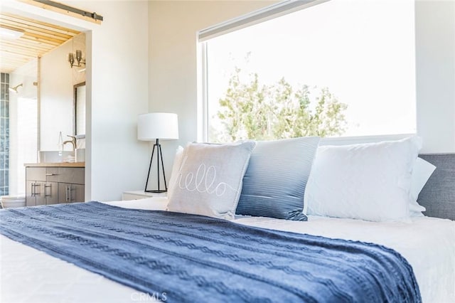 59149 Desert Gold Dr, Yucca Valley, CA 92284 - bedroom with connected bathroom and wooden ceiling