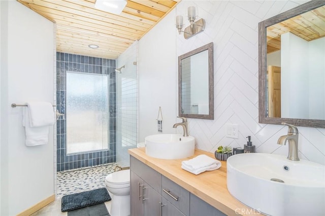 59149 Desert Gold Dr, Yucca Valley, CA 92284 - full bathroom featuring wooden ceiling, tiled shower, double vanity, tasteful backsplash, and tile walls