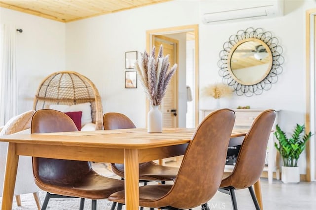 dining space featuring a wall mounted AC and wooden ceiling