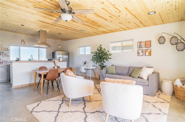 living room featuring ceiling fan and wood ceiling