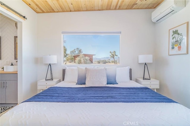 59149 Desert Gold Dr, Yucca Valley, CA 92284 - bedroom with an AC wall unit, wood ceiling, ensuite bathroom, and a barn door