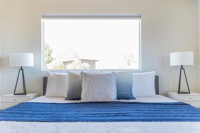 bedroom featuring multiple windows