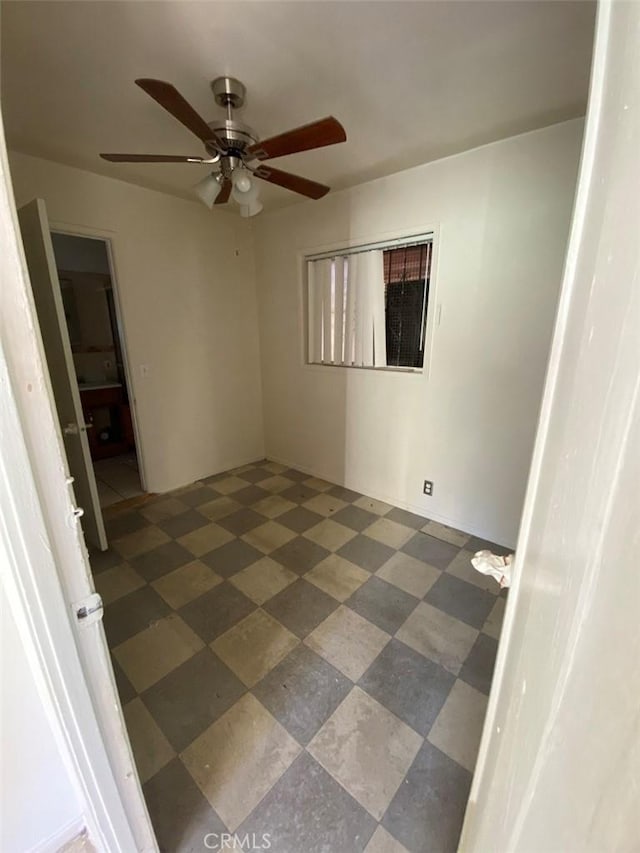 spare room with ceiling fan