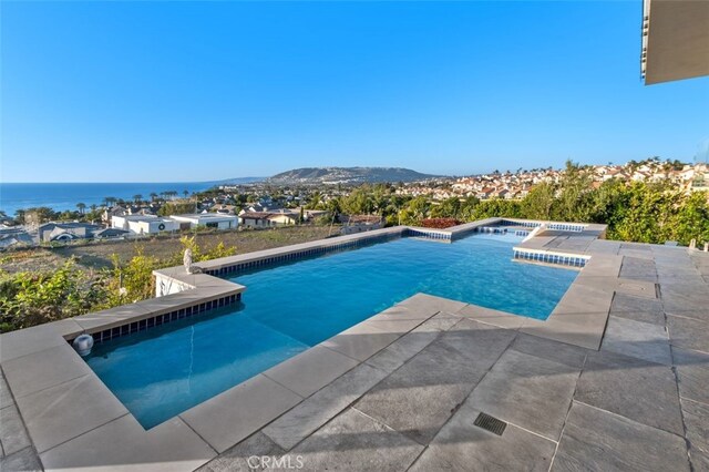 view of pool featuring a water view