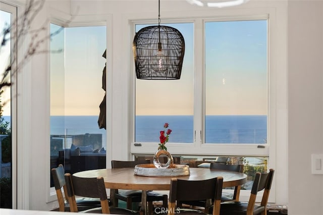 dining room featuring a water view