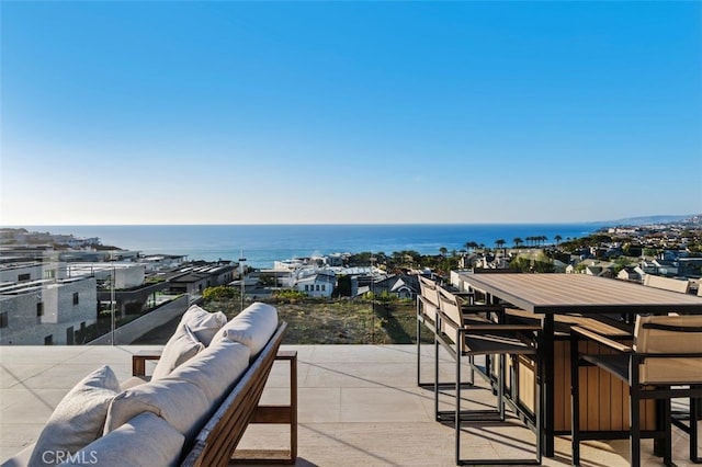 view of patio featuring an outdoor living space and a water view