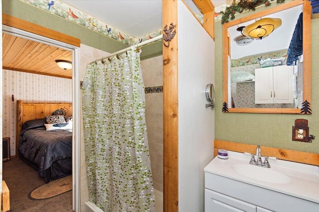 bathroom with vanity and curtained shower