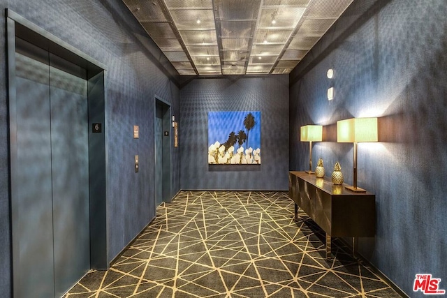 interior space featuring elevator and tile patterned flooring