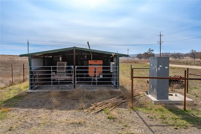 view of stable with a rural view