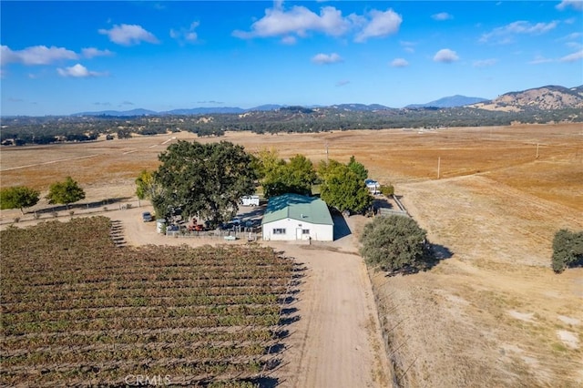 drone / aerial view featuring a rural view and a mountain view