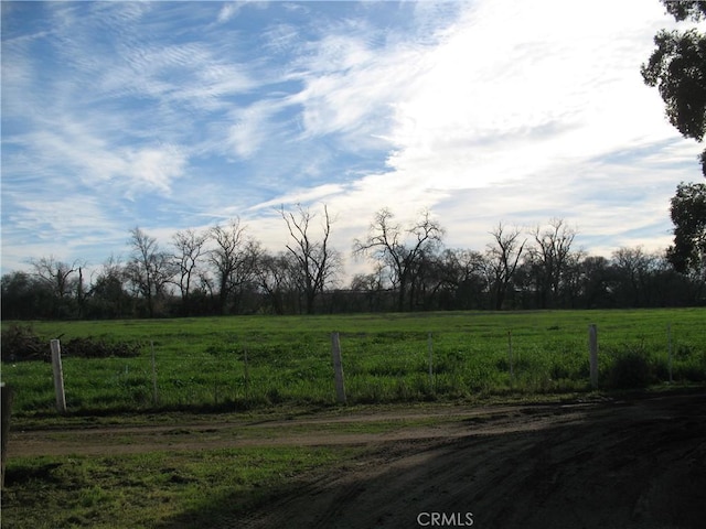 view of yard with a rural view