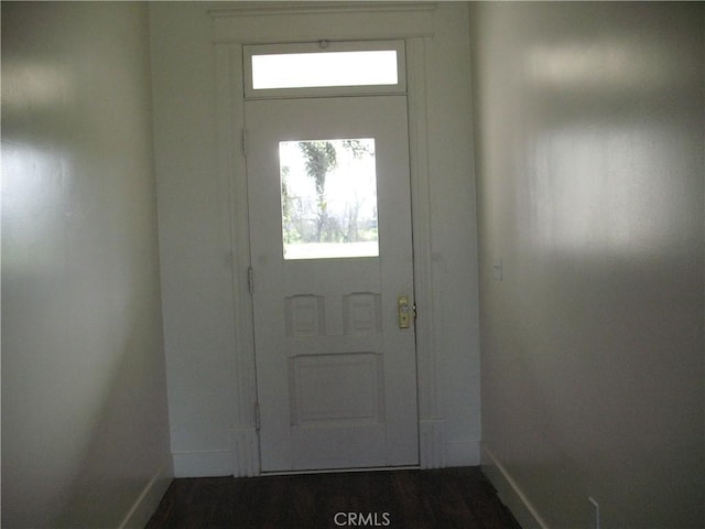 doorway to outside with dark hardwood / wood-style floors