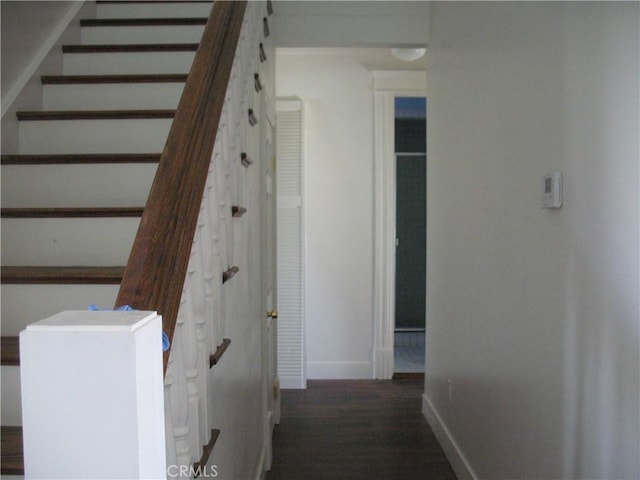 stairway featuring hardwood / wood-style flooring