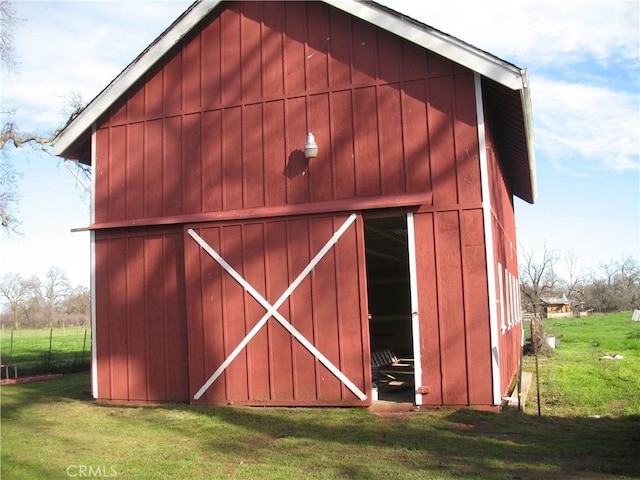 view of outdoor structure with a lawn