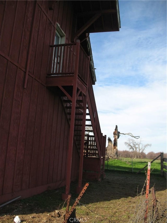 view of side of property with a rural view