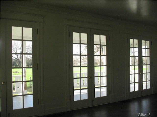 entryway with french doors and ornamental molding