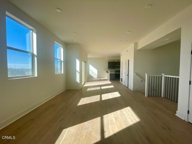 spare room featuring dark hardwood / wood-style floors