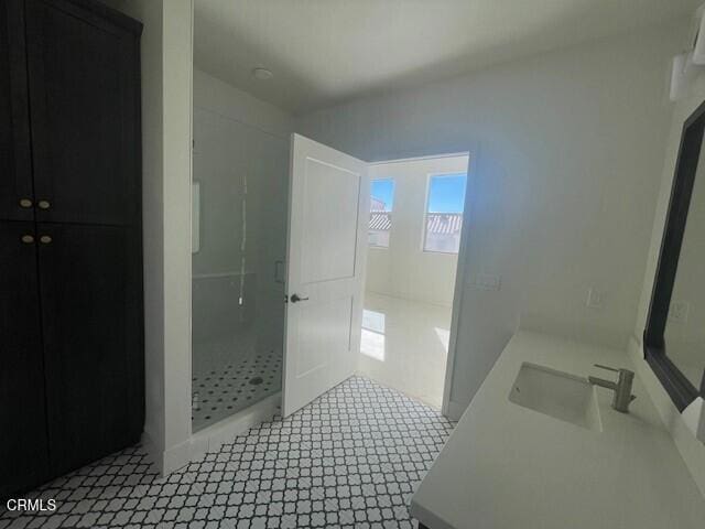bathroom with vanity and a stall shower