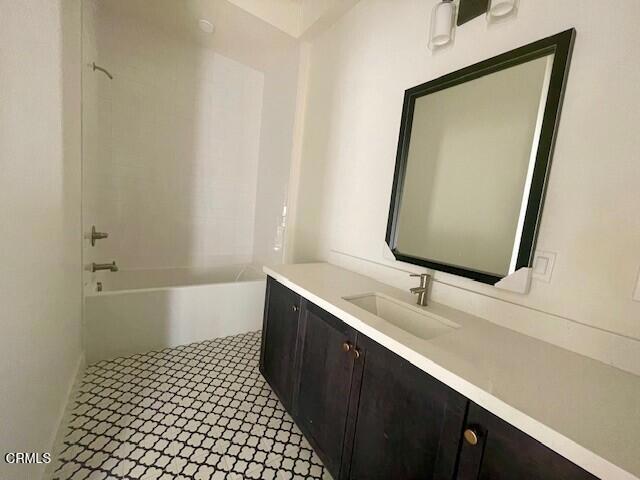 full bath featuring bathing tub / shower combination and vanity